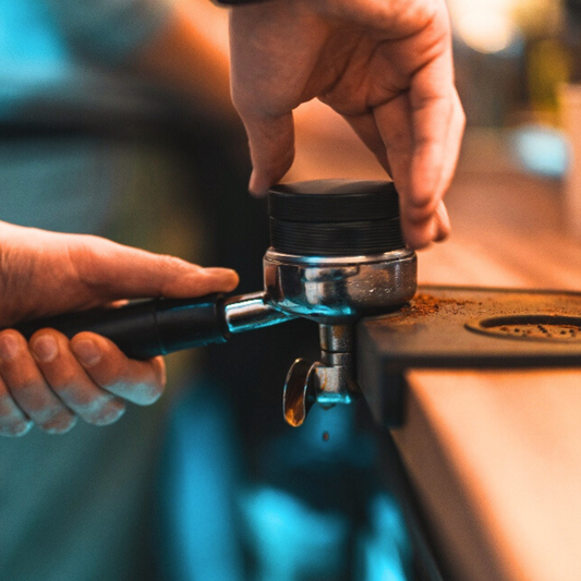 Pulling a rich, velvety shot of espresso from specialty Colombian coffee beans.